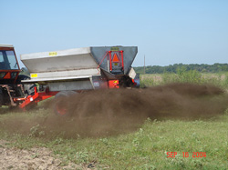Application of compost using a spreader photo